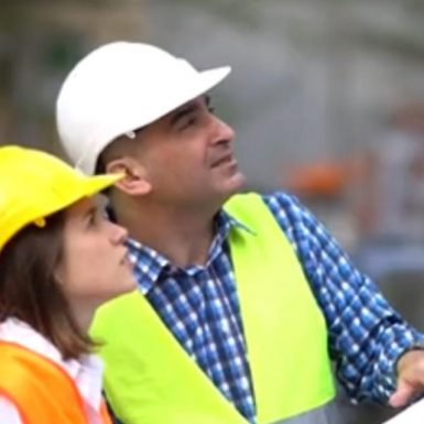 Female apprentice learning from boss