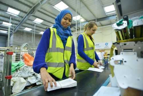 Factory workers on production line