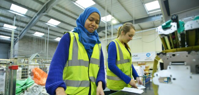 Factory workers on production line