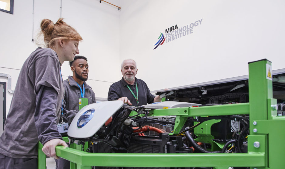 Students work on an engine at MTI