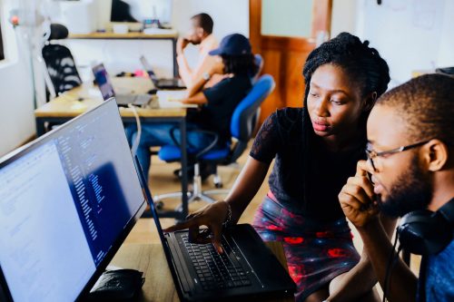 Man and Woman looking at information on a computer