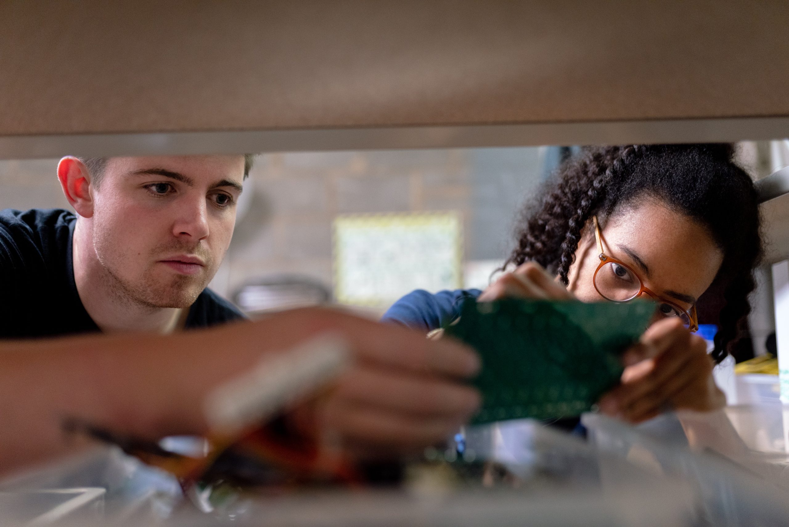 2 young people working together on a project