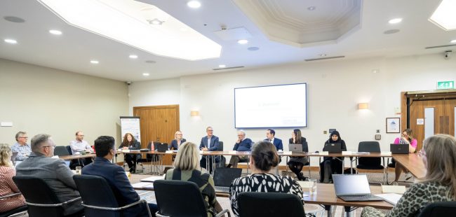 A LLBSP Board meeting. Members sat around a table